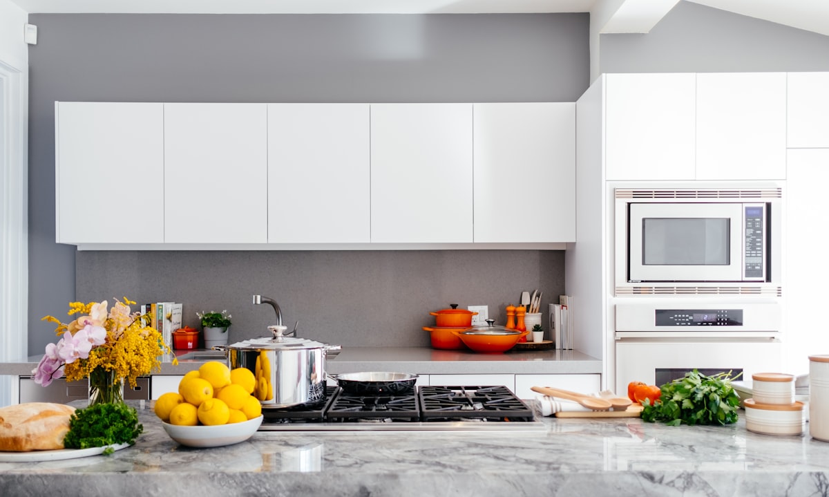Specialist cleaning a modern kitchen